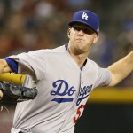 Los Angeles Dodgers pitcher Alex Wood throws during the first inning of a baseball game against the Arizona Diamondbacks, Friday, Sept. 11, 2015, in Phoenix. (AP Photo/Rick Scuteri)
