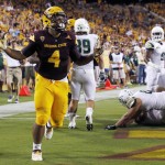 Arizona State's Demario Richard (4) tries to get the crowd going as he celebrates his running touchdown during the first half of an NCAA college football game against Cal Poly on Saturday, Sept. 12, 2015, in Tempe, Ariz. (AP Photo/Ross D. Franklin)