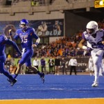 Boise State running back Jeremy McNichols (13) runs for a touchdown as quarterback Ryan Finley (15) starts to celebrate during the first half of an NCAA college football game against Washington in Boise, Idaho, on Friday, Sept. 4, 2015. (AP Photo/Otto Kitsinger)