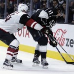 Arizona Coyotes defenseman Klas Dahlbeck, left, battles Los Angeles Kings center Anze Kopitar for the puck during the second period of an NHL preseason hockey game in Los Angeles, Tuesday, Sept. 22, 2015. (AP Photo/Chris Carlson)