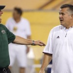 Arizona State coach Todd Graham, right, talks with Cal Poly coach Tim Walsh prior to an NCAA college football game Saturday, Sept. 12, 2015, in Tempe, Ariz. (AP Photo/Ross D. Franklin)