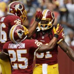 Washington Redskins running back Matt Jones (31) celebrates his touchdown with teammates defensive back Tanard Jackson (36) and running back Chris Thompson (25) during the first half of an NFL football game against the St. Louis Rams in Landover, Md., Sunday, Sept. 20, 2015. (AP Photo/Patrick Semansky)