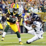 Green Bay Packers' James Jones catches a touchdown pass in front of Seattle Seahawks' Richard Sherman (25) during the first half of an NFL football game Sunday, Sept. 20, 2015, in Green Bay, Wis. (AP Photo/Mike Roemer)