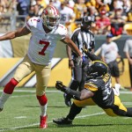 San Francisco 49ers quarterback Colin Kaepernick (7) scrambles to pass after evading Pittsburgh Steelers outside linebacker Arthur Moats (55) in the first quarter of an NFL football game, Sunday, Sept. 20, 2015, in Pittsburgh. (AP Photo/Gene Puskar)
