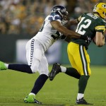 Green Bay Packers' Aaron Rodgers (12)  tries to out run Seattle Seahawks' K.J. Wright during the first half of an NFL football game, Sunday, Sept. 20, 2015 at Lambeau Field in Green Bay, Wis. (Wm. Glasheen/The Post-Crescent via AP) NO SALES