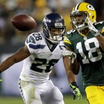 Green Bay Packers wide receiver Randall Cobb (18) catches a pass in front of the defense of Seattle Seahawks' Marcus Burley during the first half of an NFL football game, Sunday, Sept. 20, 2015 at Lambeau Field in Green Bay, Wis. (Wm. Glasheen/The Post-Crescent via AP) NO SALES