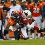 Arizona Cardinals defensive back Jimmy Legree (46) intercepts a pass intended for Denver Broncos wide receiver Cody Latimer (14) during the first half of an NFL preseason football game, Thursday, Sept. 3, 2015, in Denver. (AP Photo/Joe Mahoney)