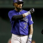 Colorado Rockies' Jose Reyes (7) gestures to his bench after a base hit during the first inning of a baseball game against the Arizona Diamondbacks, Tuesday, Sept. 29, 2015, in Phoenix. (AP Photo/Matt York)