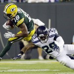 Green Bay Packers' Randall Cobb tries to get past Seattle Seahawks' Earl Thomas (29) during the first half of an NFL football game Sunday, Sept. 20, 2015, in Green Bay, Wis. (AP Photo/Jeffrey Phelps)