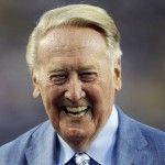 Los Angeles Dodgers broadcaster Vin Scully is honored before a baseball game against the Arizona Diamondbacks in Los Angeles, Wednesday, Sept. 23, 2015. Scully was given a Guinness World Records certificate for the longest career as a sports broadcaster for a single team. (AP Photo/Alex Gallardo)