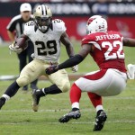 New Orleans Saints running back Khiry Robinson (29) gains yards as Arizona Cardinals strong safety Tony Jefferson (22) defends during the first half of an NFL football game, Sunday, Sept. 13, 2015, in Glendale, Ariz. (AP Photo/Rick Scuteri)