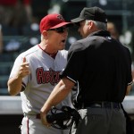 Arizona Diamondbacks manager Chip Hale (3) argues with umpire Tim Timmons about a foul ball call during the second inning of the first baseball game of a double header against the Colorado Rockies Tuesday, Sept. 1, 2015, in Denver.  After review, the call was reversed and Jarrod Saltalamacchia was credited with a home run. (AP Photo/Jack Dempsey)
