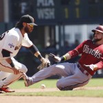 Arizona Diamondbacks' Ender Inciarte, right, slides safely into second base with a double as San Francisco Giants' Brandon Crawford covers during the fourth inning of a baseball game, Sunday, Sept. 20, 2015, in San Francisco. The Giants won 5-1. (AP Photo/George Nikitin)