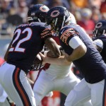 Chicago Bears quarterback Jay Cutler hands off  to running back Matt Forte (22) during the first half of an NFL football game against the Arizona Cardinals, Sunday, Sept. 20, 2015, in Chicago. (AP Photo/David Banks)