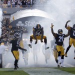 Pittsburgh Steelers Vince Williams (98), Shamarko Thomas (29) and teammates leap as they take the field for the start of their home opener NFL football game against the San Francisco 49ers, Sunday, Sept. 20, 2015, in Pittsburgh. (AP Photo/Gene Puskar)