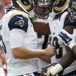 St. Louis Rams quarterback Nick Foles (5) and wide receiver Kenny Britt (18) celebrate Britt's touchdown during the second half of an NFL football game against the Washington Redskins in Landover, Md., Sunday, Sept. 20, 2015. (AP Photo/Alex Brandon)