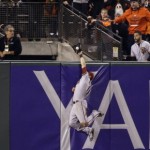 Arizona Diamondbacks center fielder A.J. Pollock makes a catch at the wall on a fly ball from San Francisco Giants' Jarrett Parker during the eighth inning of a baseball game on Friday, Sept. 18, 2015, in San Francisco. (AP Photo/Marcio Jose Sanchez)