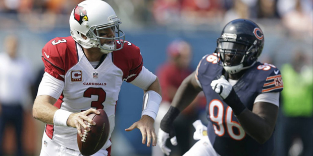 Arizona Cardinals quarterback Carson Palmer (3) scrambles away from Chicago Bears defensive tackle ...