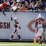 Arizona Cardinals safety Tony Jefferson (22) celebrates after intercepting a pass for a touchdown during the first half of an NFL football game against the Chicago Bears, Sunday, Sept. 20, 2015, in Chicago. (AP Photo/Michael Conroy)