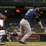 San Diego Padres' Derek Norris (3) runs to first base connecting on a run-scoring single as Arizona Diamondbacks' Welington Castillo, left, watches during the first inning of a baseball game Monday, Sept. 14, 2015, in Phoenix. (AP Photo/Ross D. Franklin)