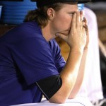 Colorado Rockies starting pitcher Jon Gray sits in the dugout after being pulled during the sixth inning of a baseball game against the Arizona Diamondbacks on Wednesday, Sept. 2, 2015, in Denver. (AP Photo/Jack Dempsey)