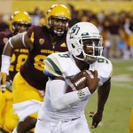 Cal Poly's Chris Brown (9) tries to get past Arizona State defenders as he runs with the ball during the first half of an NCAA college football game Saturday, Sept. 12, 2015, in Tempe, Ariz. (AP Photo/Ross D. Franklin)