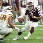 Texas A&M quarterback Kyler Murray (1) tries to elude Arizona State linebacker Salamo Fiso (58) in the second half of an NCAA college football game on Saturday, Sept. 5, 2015, in Houston. (AP Photo/George Bridges)