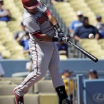 Arizona Diamondbacks' Yasmany Tomas hits a RBI-single during the second inning of a baseball game against the Los Angeles Dodgers in Los Angeles, Thursday, Sept. 24, 2015. (AP Photo/Chris Carlson)