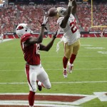 Arizona Cardinals wide receiver John Brown (12) can't make the catch as San Francisco 49ers cornerback Kenneth Acker (20) defends during the first half of an NFL football game, Sunday, Sept. 27, 2015, in Glendale, Ariz.  (AP Photo/Ross D. Franklin)