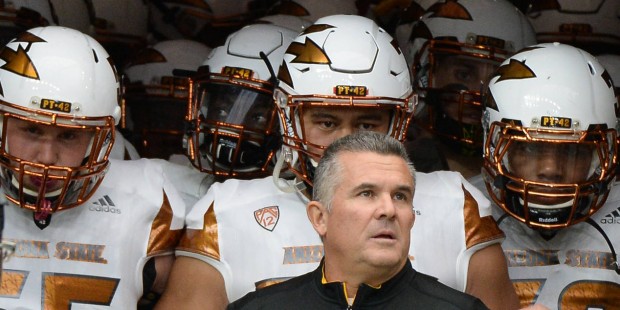 Arizona State head coach Todd Graham prepares to lead his team onto the field to face Texas A&M in ...