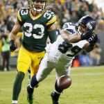 Seattle Seahawks' Doug Baldwin can't catch a pass in front of Green Bay Packers' Micah Hyde (33) during the second half of an NFL football game Sunday, Sept. 20, 2015, in Green Bay, Wis. (AP Photo/Mike Roemer)