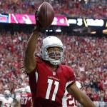 Arizona Cardinals wide receiver Larry Fitzgerald (11) celebrates his touchdown against the San Francisco 49ers during the second half of an NFL football game, Sunday, Sept. 27, 2015, in Glendale, Ariz.  (AP Photo/Ross D. Franklin)