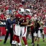Arizona Cardinals wide receiver John Brown (12) celebrates his touchdown reception with teammate Michael Floyd (15) during the first half of an NFL football game against the New Orleans Saints, Sunday, Sept. 13, 2015, in Glendale, Ariz. (AP Photo/Ross D. Franklin)