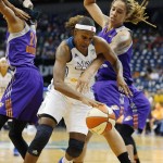Minnesota Lynx forward Rebekkah Brunson (32) drives the ball around Phoenix Mercury center Brittney Griner (42) during the first half of Game 1 of the WNBA basketball Western Conference finals, Thursday, Sept. 24, 2015, in Minneapolis. (AP Photo/Stacy Bengs)