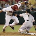 San Francisco Giants' Ehire Adrianza (1) tags Arizona Diamondbacks' David Peralta, left, out at third base during the fourth inning of a baseball game Tuesday, Sept. 8, 2015, in Phoenix. (AP Photo/Ross D. Franklin)