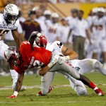 New Mexico wide receiver Dameon Gamblin (2) is hit by Arizona State defensive back Jordan Simone during the first half of an NCAA college football game, Friday, Sept. 18, 2015, in Tempe, Ariz. (AP Photo/Matt York)
