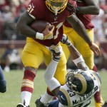 Washington Redskins running back Matt Jones (31) is stopped by St. Louis Rams free safety Rodney McLeod (23) during the first half of an NFL football game in Landover, Md., Sunday, Sept. 20, 2015. (AP Photo/Alex Brandon)