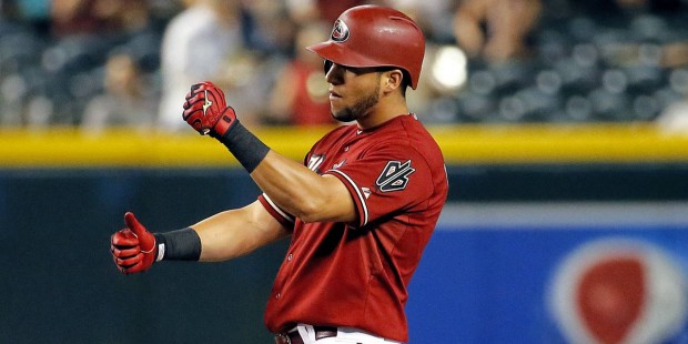 Arizona Diamondbacks' David Peralta motions to his bench after hitting a stand-up double against th...