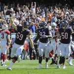 Chicago Bears linebacker Jared Allen (69) celebrates after intercepting a pass during the first half of an NFL football game against the Arizona Cardinals, Sunday, Sept. 20, 2015, in Chicago. (AP Photo/David Banks)