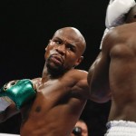 
              Floyd Mayweather Jr. hits Andre Berto during their welterweight title boxing bout Saturday, Sept. 12, 2015, in Las Vegas. (AP Photo/John Locher)
            