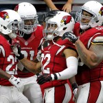 Arizona Cardinals free safety Tyrann Mathieu (32) celebrates his interception for a touchdown with teammates against the San Francisco 49ers during the first half of an NFL football game against the, Sunday, Sept. 27, 2015, in Glendale, Ariz.  (AP Photo/Ross D. Franklin)