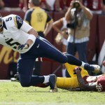 St. Louis Rams quarterback Nick Foles (5) is sacked by Washington Redskins free safety Dashon Goldson (38) during the second half of an NFL football game in Landover, Md., Sunday, Sept. 20, 2015. The Redskins defeated the Rams 24-10. (AP Photo/Alex Brandon)