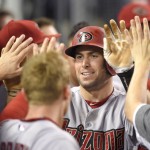 Arizona Diamondbacks' Paul Goldschmidt is congratulated by teammates after hitting a solo home run during the eighth inning of a baseball game against the Los Angeles Dodgers, Monday, Sept. 21, 2015, in Los Angeles. (AP Photo/Mark J. Terrill)