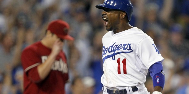 Los Angeles Dodgers' Jimmy Rollins (11) scores on a double by Chase Utley, as Arizona Diamondbacks ...