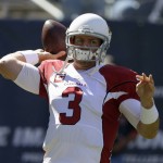 Arizona Cardinals quarterback Carson Palmer (3) warms up  before an NFL football game against the Chicago Bears, Sunday, Sept. 20, 2015, in Chicago. (AP Photo/Michael Conroy)