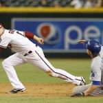 Arizona Diamondbacks second baseman Phil Gosselin, left, gets the force out on Los Angeles Dodgers Corey Seager during the ninth inning on a ball hit by A.J. Ellis during a baseball game, Friday, Sept. 11, 2015, in Phoenix. The Diamondbacks won 12-4. (AP Photo/Rick Scuteri)