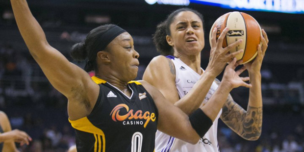 Phoenix Mercury's Candice Dupree (4) drives to the basket against Tulsa Shock's Odyssey Sims (0) du...