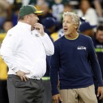 Green Bay Packers head coach Mike McCarthy, left, talks to Seattle Seahawks head coach Pete Carroll before an NFL football game Sunday, Sept. 20, 2015, in Green Bay, Wis. (AP Photo/Jeffrey Phelps)