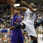 Minnesota Lynx forward Rebekkah Brunson (32) goes up to the basket past Phoenix Mercury center Brittney Griner (42) during the first half of Game 1 of the WNBA basketball Western Conference finals, Thursday, Sept. 24, 2015, in Minneapolis. (AP Photo/Stacy Bengs)