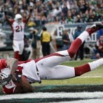 Arizona Cardinals strong safety Adrian Wilson intercepts a pass intended for Philadelphia Eagles wide receiver Steve Smith during an NFL football game Sunday, Nov. 13, 2011, in Philadelphia. (AP Photo/Mel Evans)